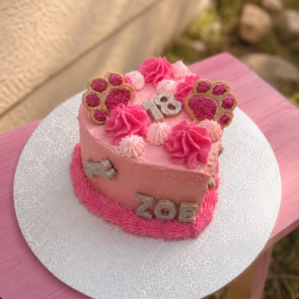 A small classic heart-shaped cake in pink